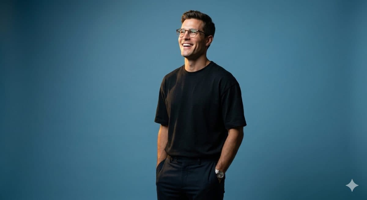 Ultra Realistic Cinematic Studio Portrait | Laughing Man in Oversized Black T-Shirt | Hands in Pockets 8K created with Gemini